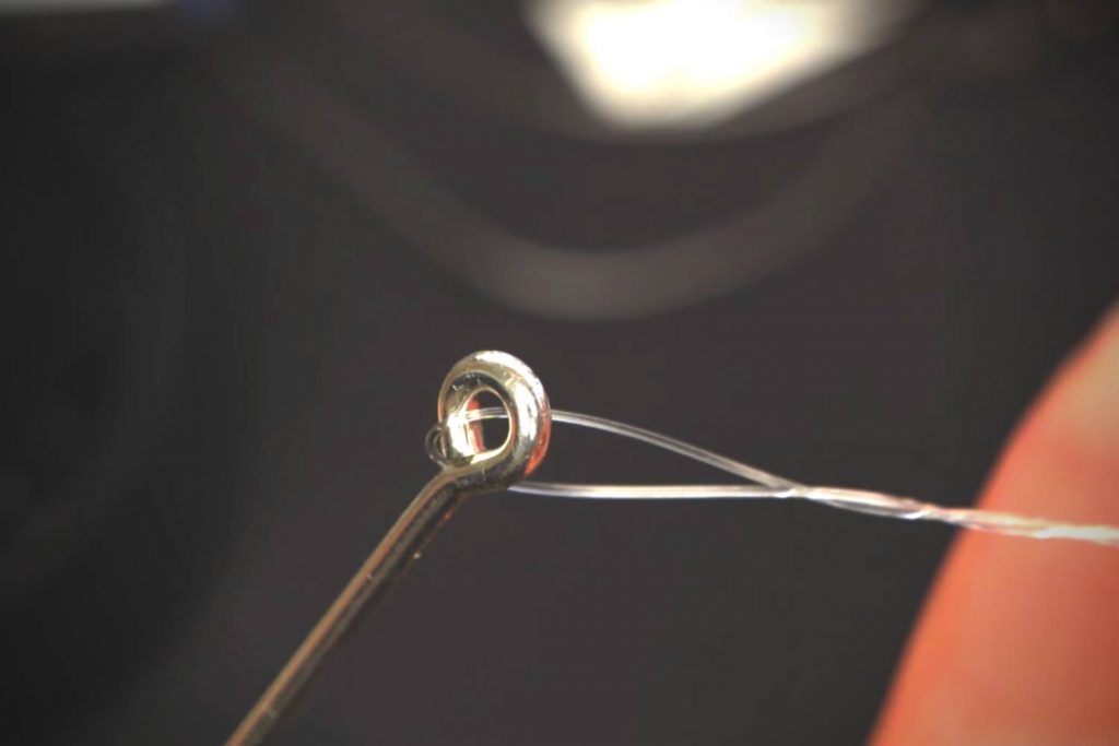 How do you tie an improved clinch knot quickly?